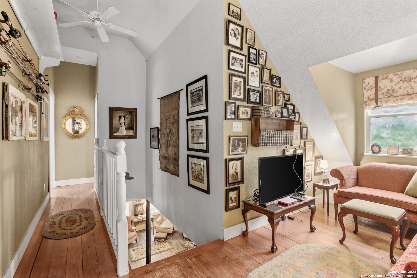211 Riverside Drive West Llano, TX 78643 - Photo 35 of 74 a living room with furniture a flat screen tv and a floor to ceiling window