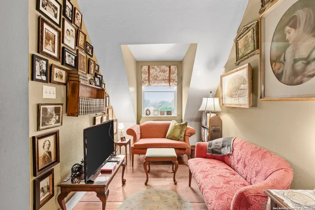 a bedroom with a bed and a mirror on the dresser