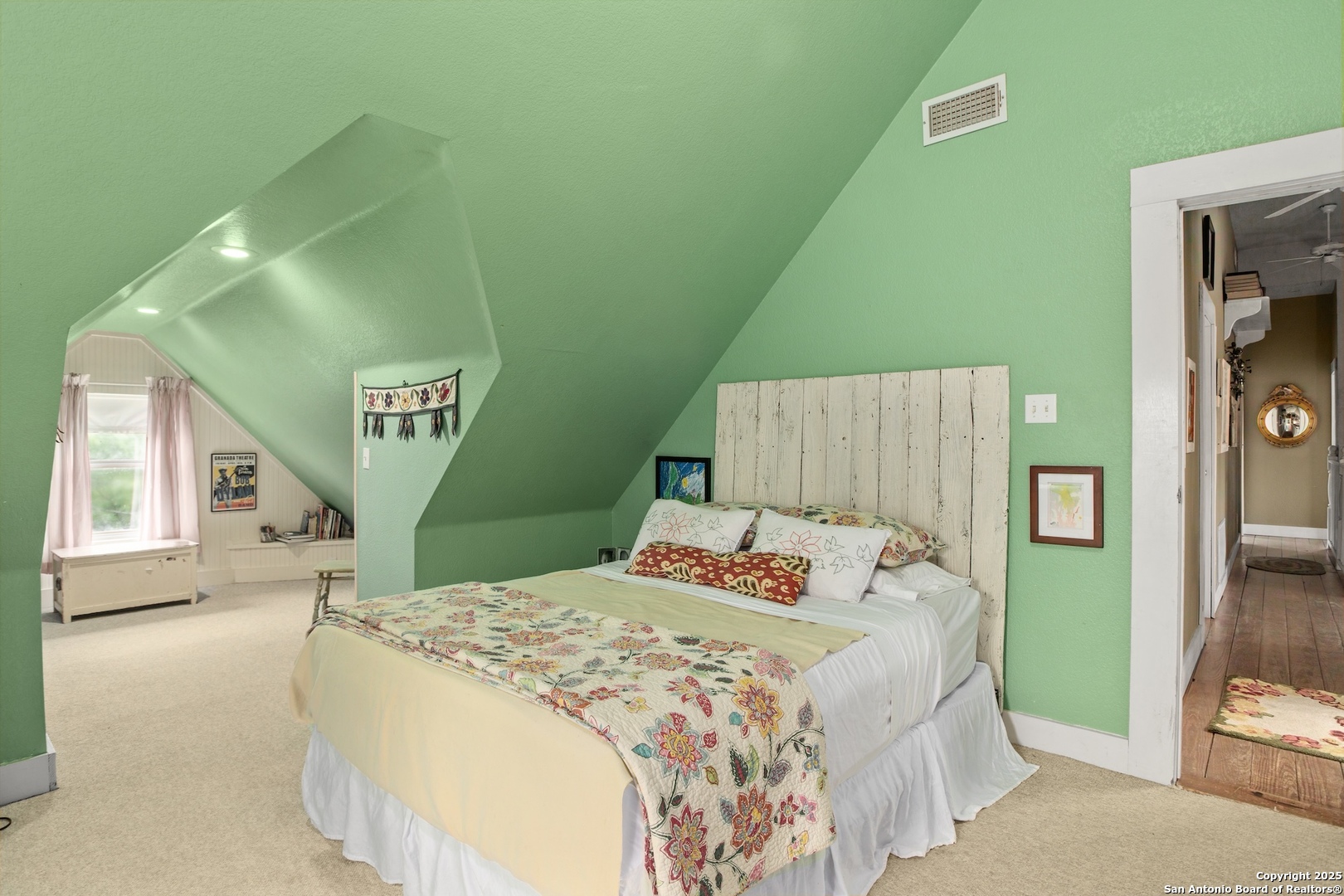 211 Riverside Drive West Llano, TX 78643 - Photo 40 of 74 a bedroom with a bed and a painting on the wall