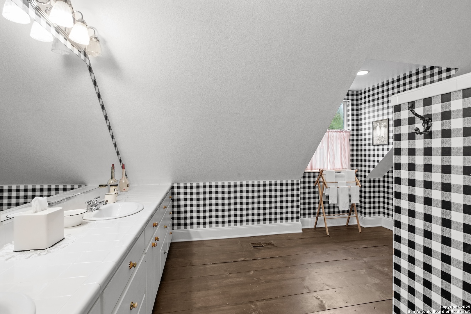 211 Riverside Drive West Llano, TX 78643 - Photo 45 of 74 a bathroom with a sink and a mirror