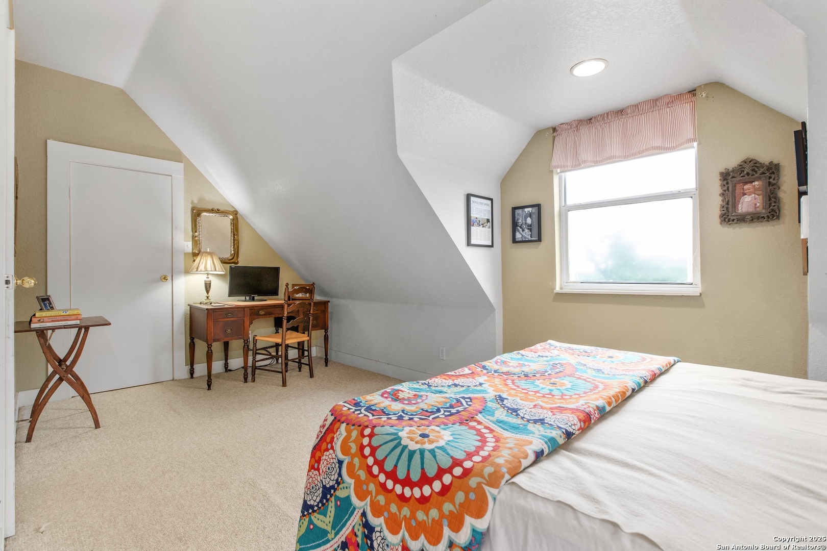 211 Riverside Drive West Llano, TX 78643 - Photo 52 of 74 a bedroom with a bed and a chandelier