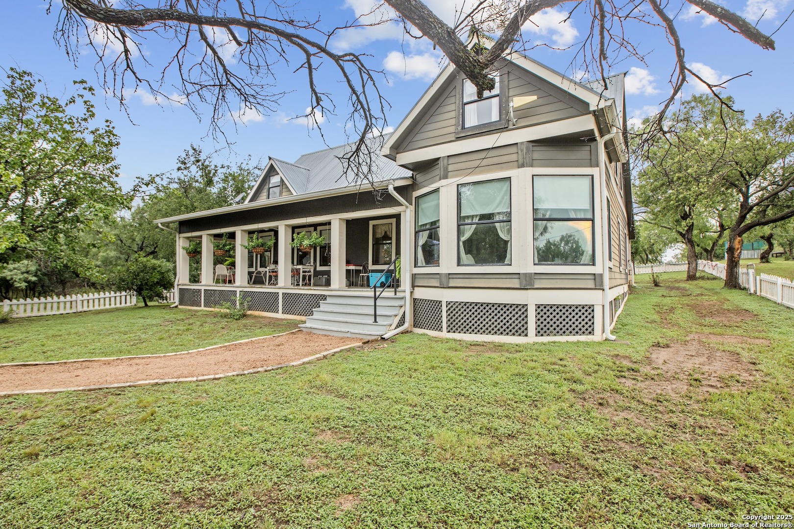 211 Riverside Drive West Llano, TX 78643 - Photo 62 of 74 a view of a house with a yard and sitting area