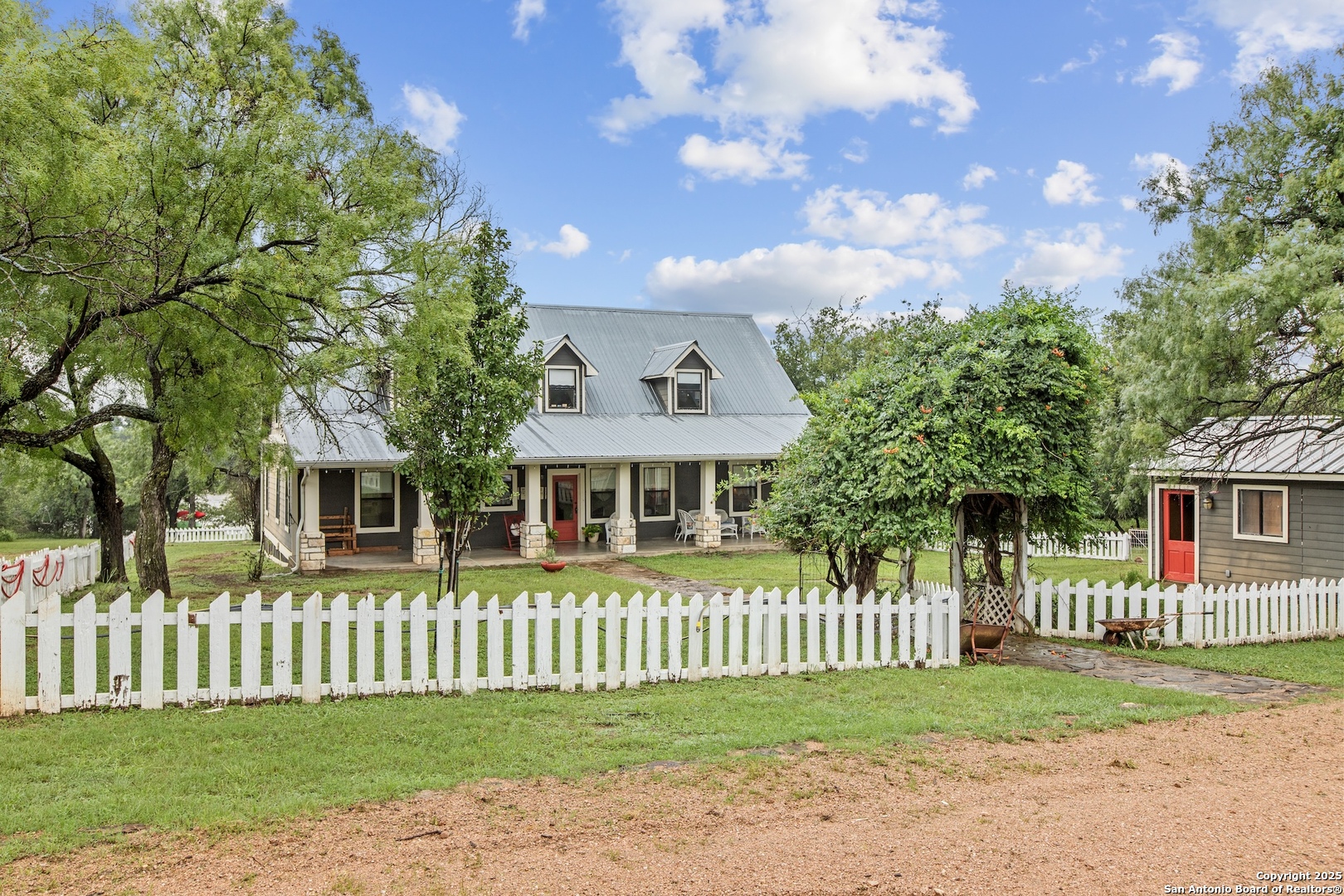 211 Riverside Drive West Llano, TX 78643 - Photo 67 of 74 a front view of a house with a garden