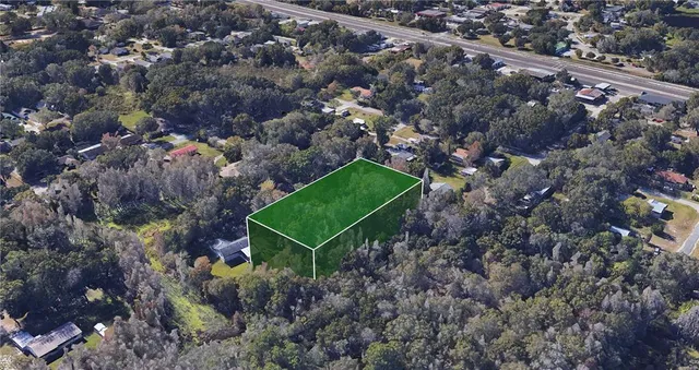 a aerial view of a house with a yard