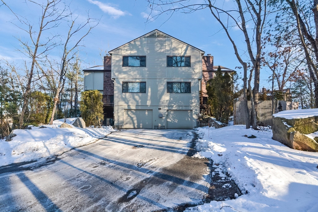 90 Mountain Gate Road, Unit 90 Ashland, MA 01721 - Photo 1 of 29 a front view of a house with a yard