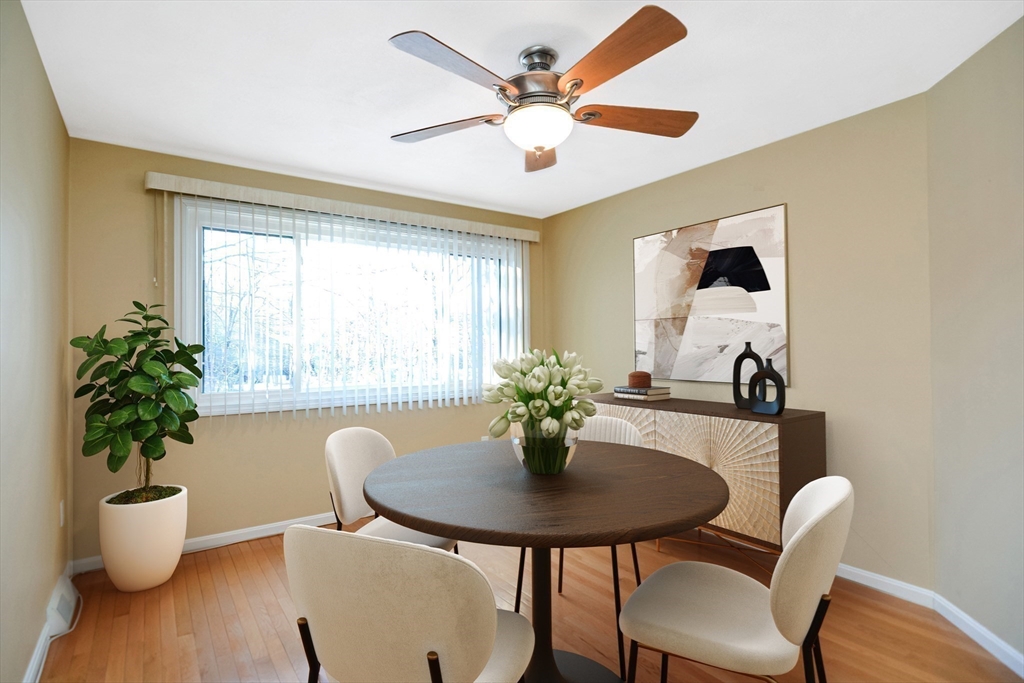 90 Mountain Gate Road, Unit 90 Ashland, MA 01721 - Photo 11 of 29 a view of a dining room with furniture and a potted plant