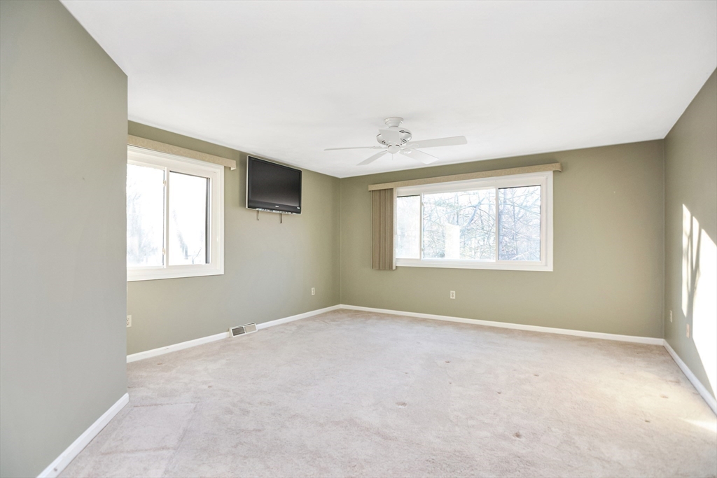90 Mountain Gate Road, Unit 90 Ashland, MA 01721 - Photo 16 of 29 a view of an empty room with a window