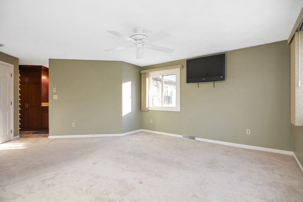 90 Mountain Gate Road, Unit 90 Ashland, MA 01721 - Photo 17 of 29 a view of an empty room with a window
