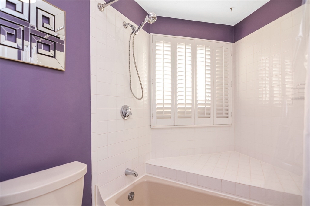 90 Mountain Gate Road, Unit 90 Ashland, MA 01721 - Photo 20 of 29 a bathroom with a bathtub and a shower