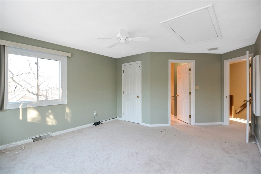 90 Mountain Gate Road, Unit 90 Ashland, MA 01721 - Photo 23 of 29 a view of an empty room with a window