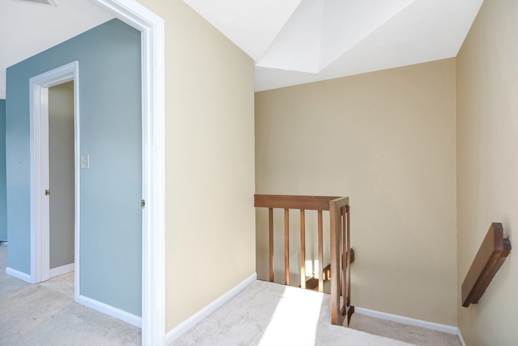 90 Mountain Gate Road, Unit 90 Ashland, MA 01721 - Photo 26 of 29 a view of a hallway with windows and stairs