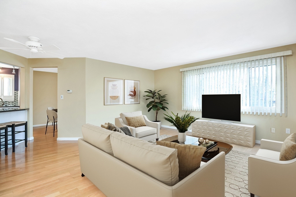 90 Mountain Gate Road, Unit 90 Ashland, MA 01721 - Photo 3 of 29 a living room with furniture and a flat screen tv