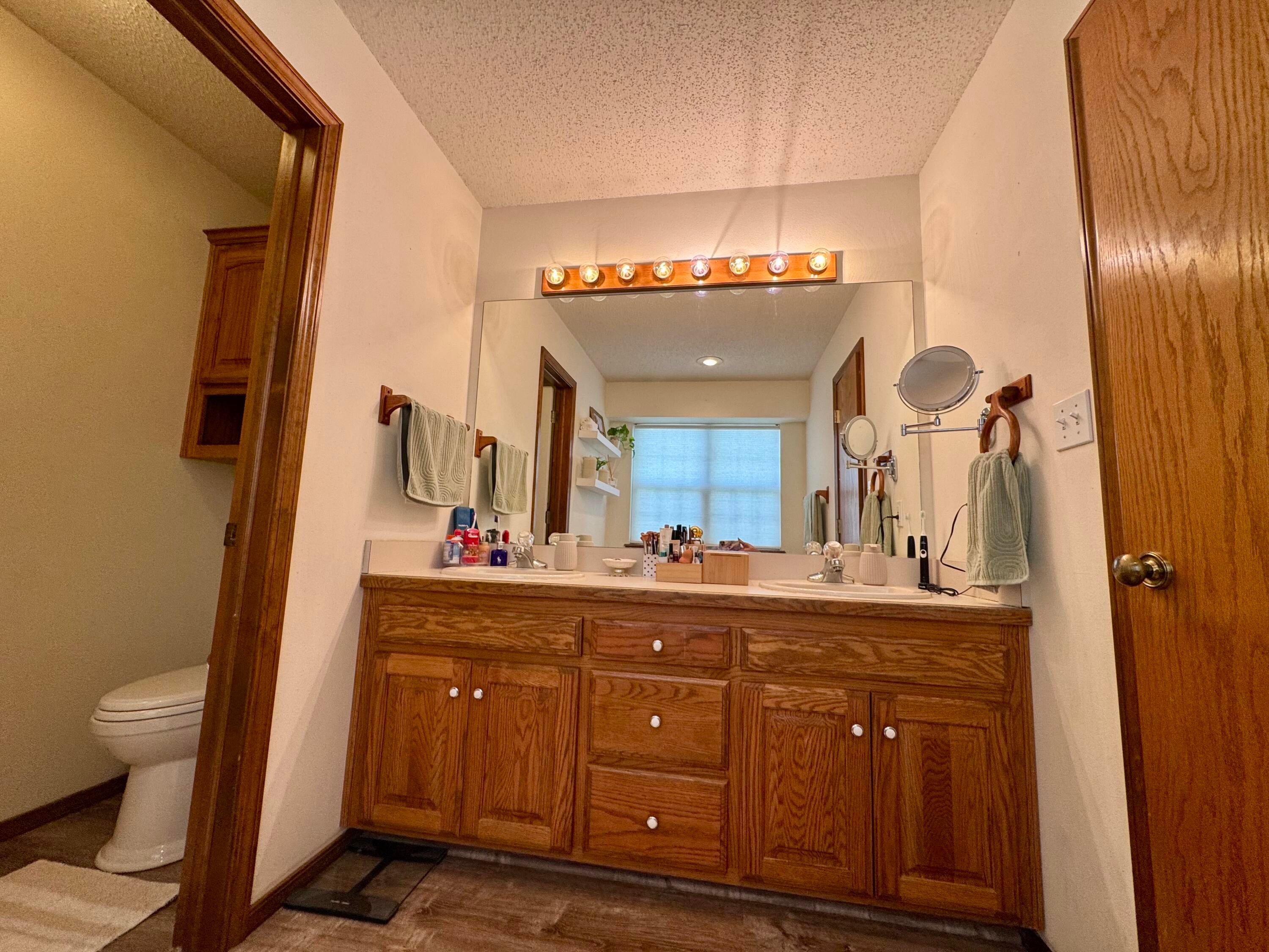 61801 East 93 Road Miami, OK 74354 - Photo 29 of 33 Master bedroom vanity leads to separate shower