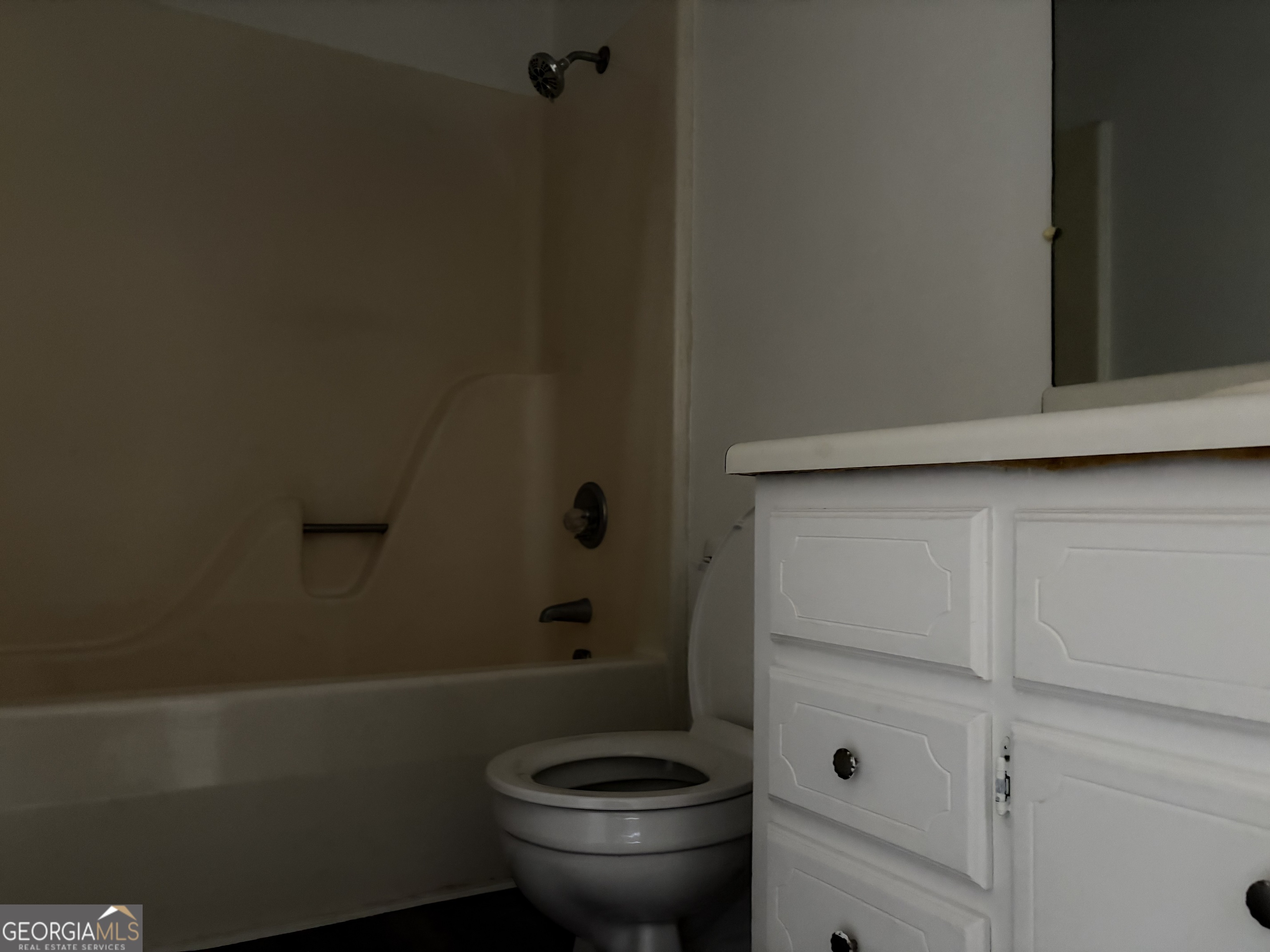 169 Ext N Jefferson Street Lyons, GA 30436 - Photo 12 of 18 a bathroom with a toilet and a shower