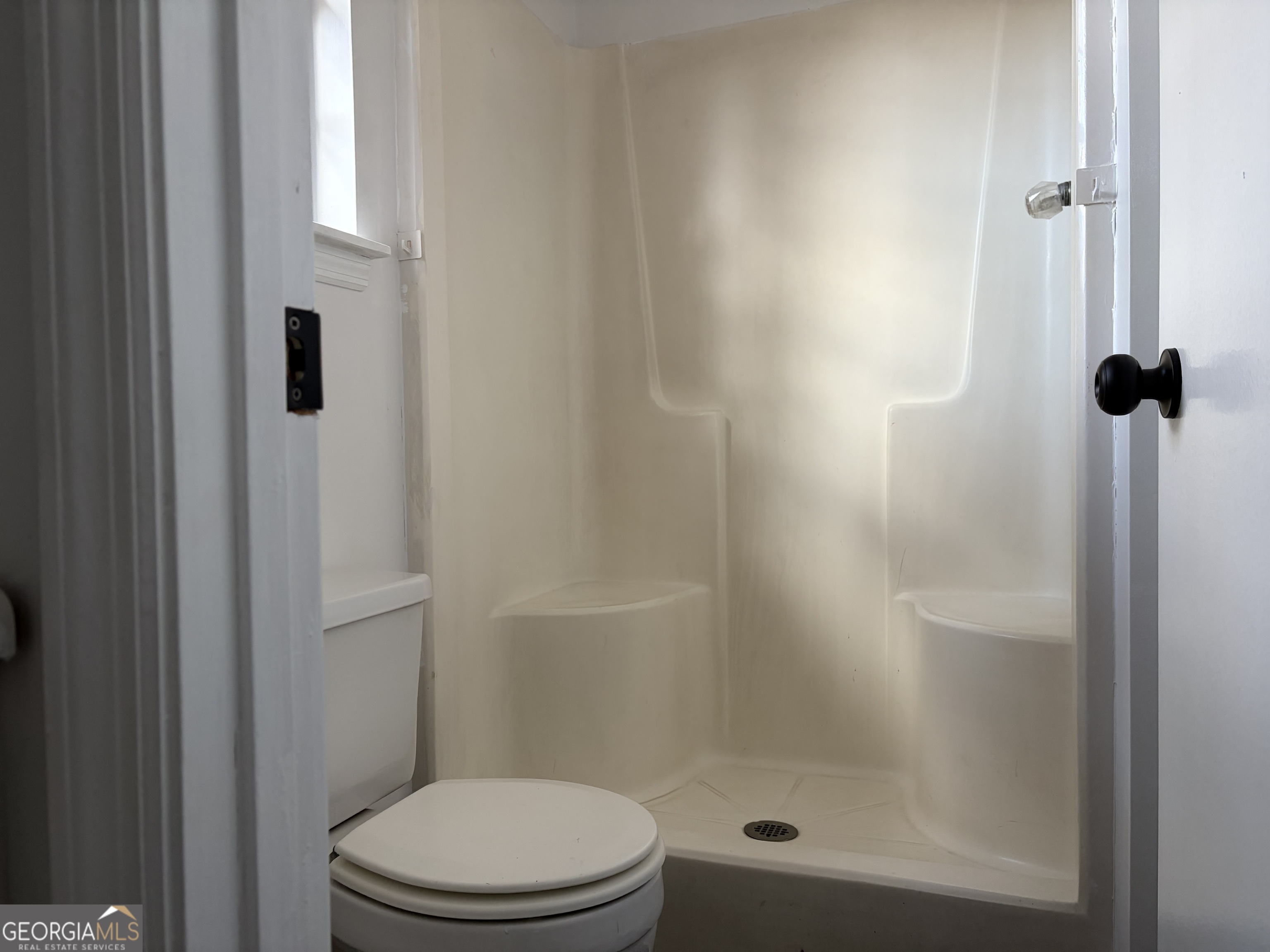 169 Ext N Jefferson Street Lyons, GA 30436 - Photo 15 of 18 a bathroom with a shower and a toilet