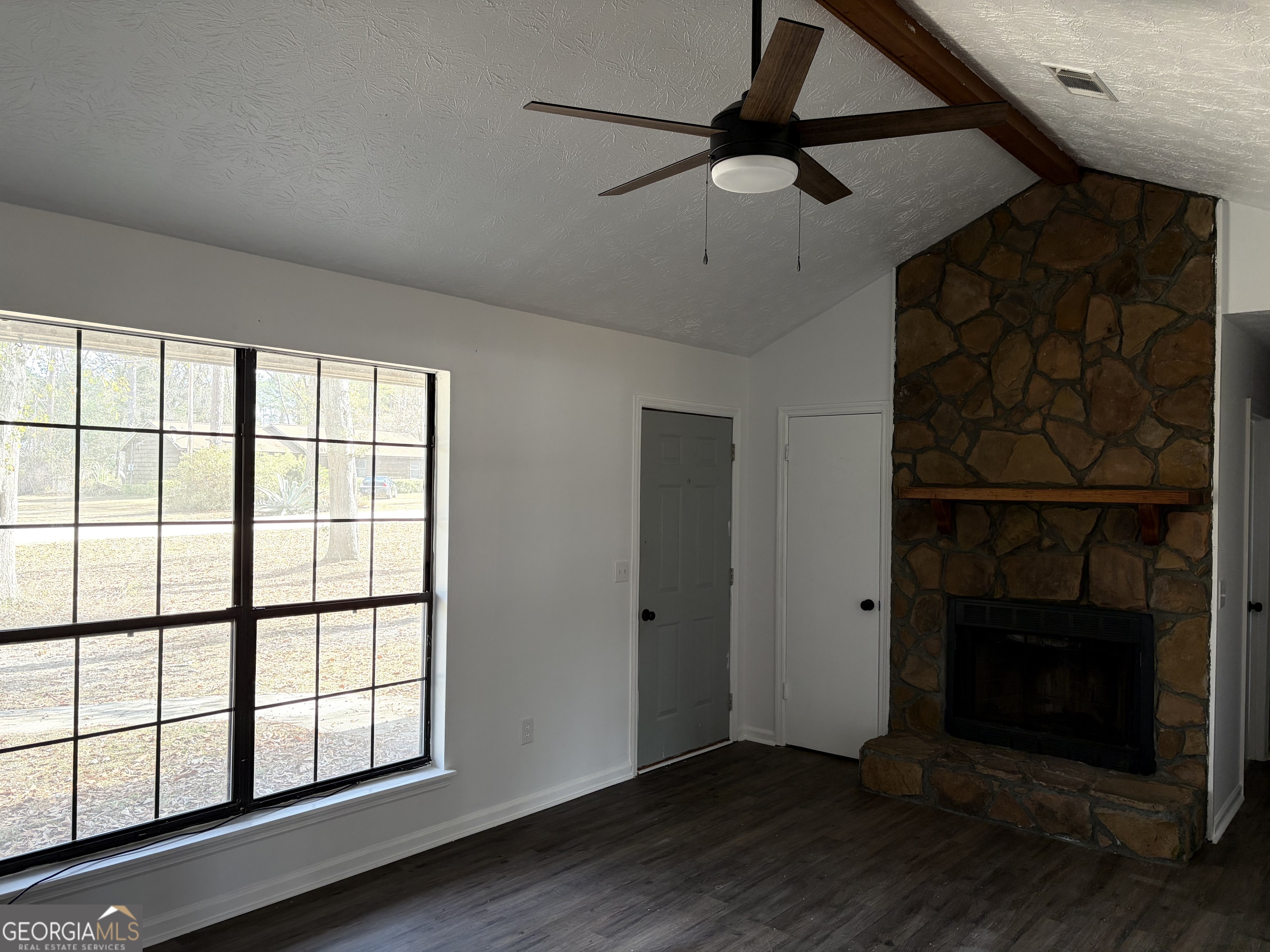 169 Ext N Jefferson Street Lyons, GA 30436 - Photo 5 of 18 a view of empty room with wooden floor and fan
