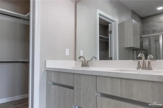a bathroom with a sink and a mirror