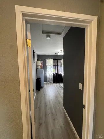 a living room with furniture window and wooden floor