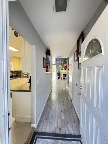 a view of a living room and hardwood floor