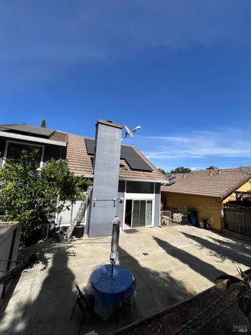 a swimming pool with some potted plants