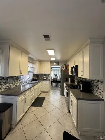 a large kitchen with cabinets