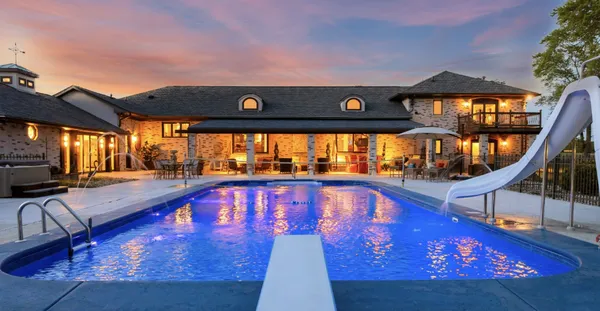 a view of swimming pool with seating area