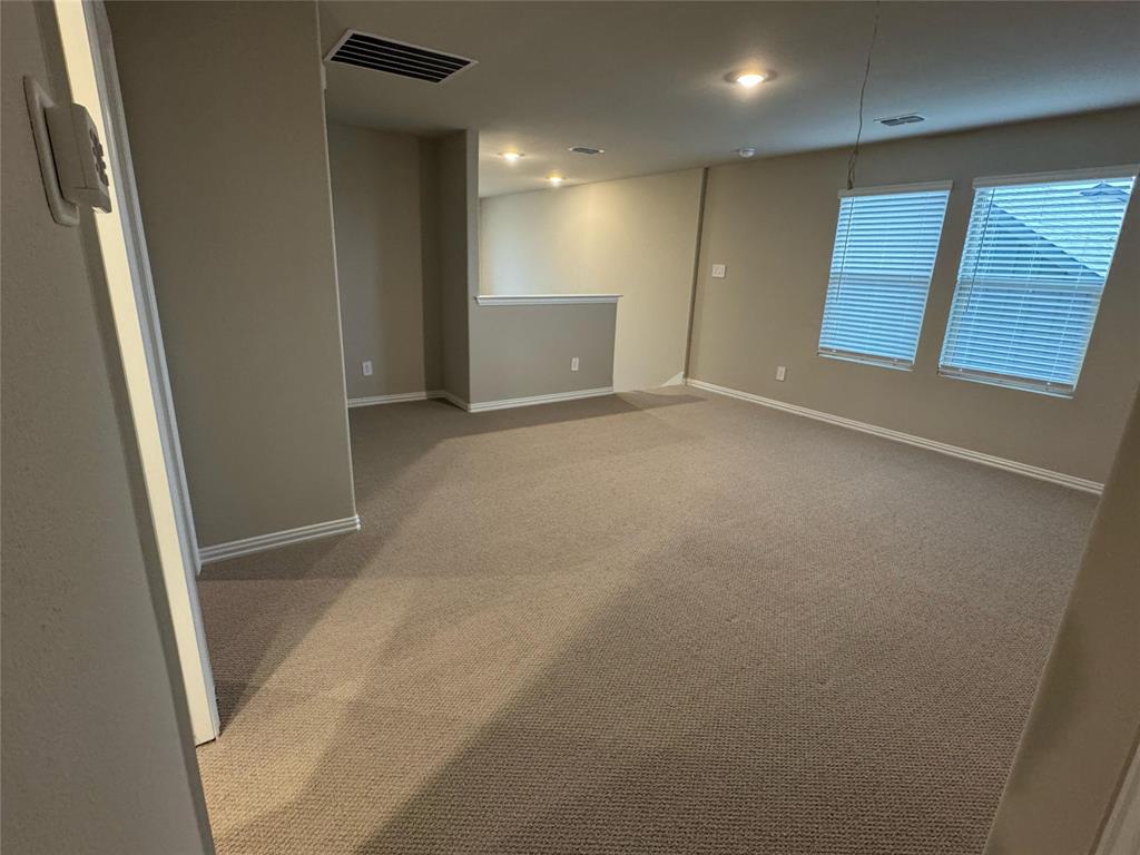 2403 States Street Princeton, TX 75407 - Photo 25 of 39 Carpeted spare room with baseboards