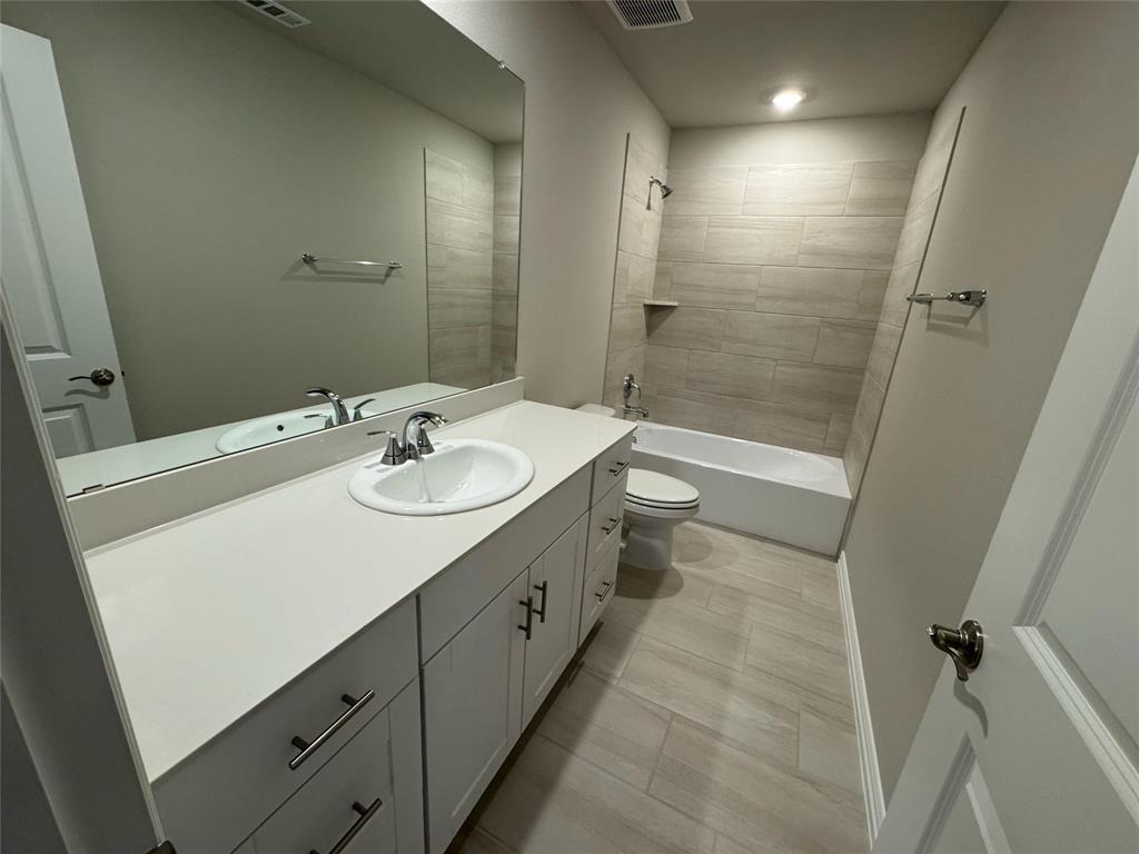 2403 States Street Princeton, TX 75407 - Photo 29 of 39 Bathroom with vanity and shower / tub combination