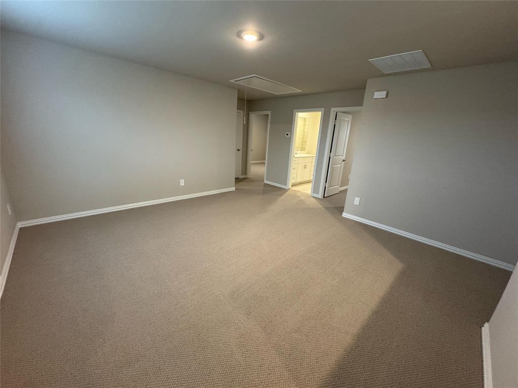 2403 States Street Princeton, TX 75407 - Photo 31 of 39 Spare room with attic access and carpet floors