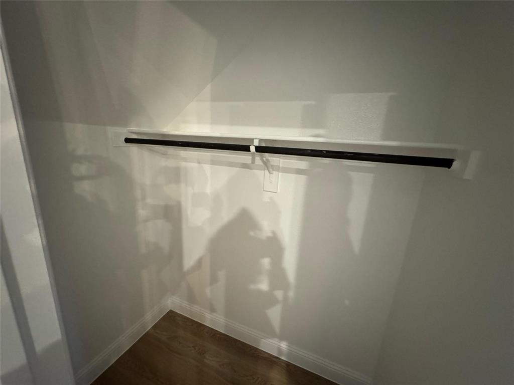 2403 States Street Princeton, TX 75407 - Photo 34 of 39 Detailed view of wood finished floors and baseboards