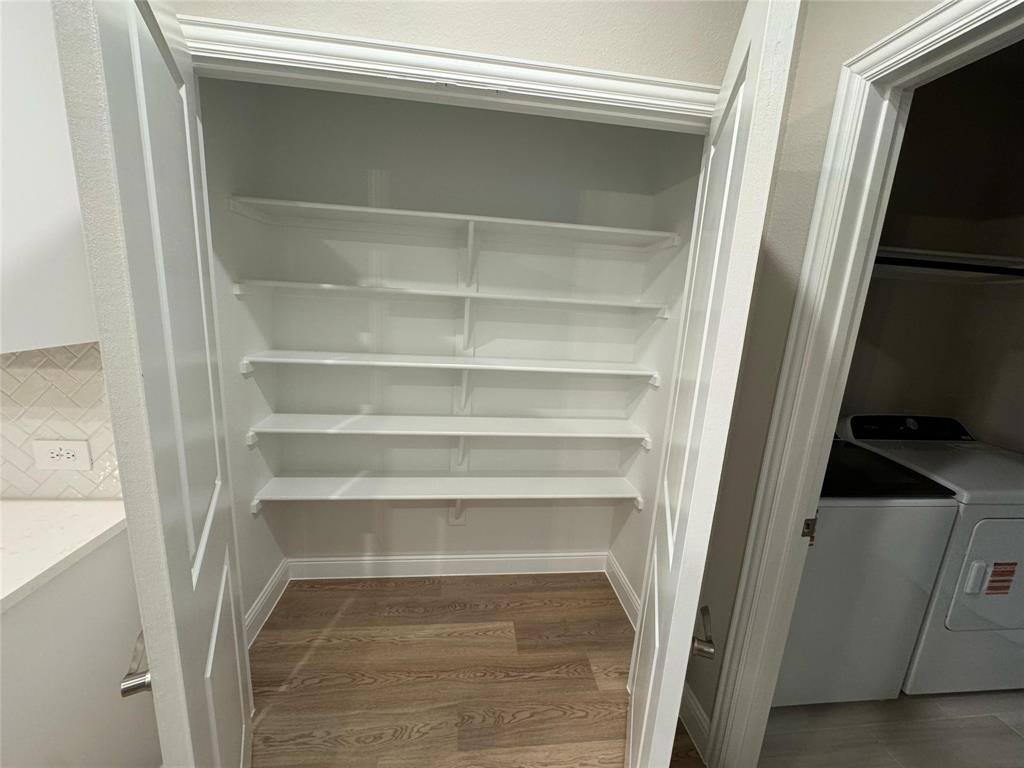 2403 States Street Princeton, TX 75407 - Photo 35 of 39 Pantry with washer and clothes dryer