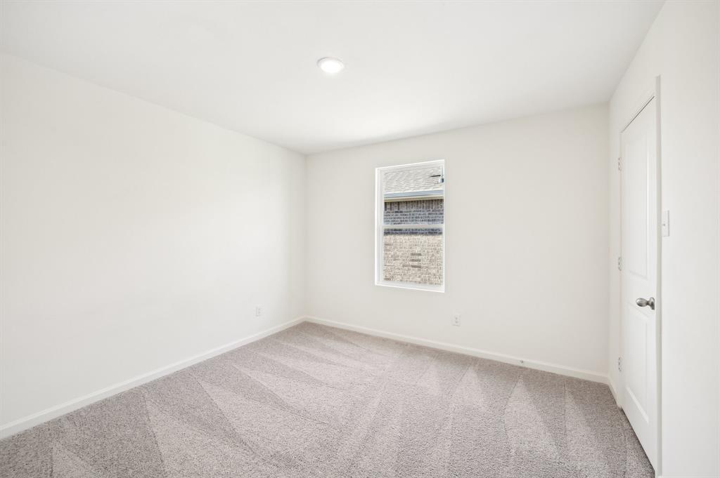 2403 States Street Princeton, TX 75407 - Photo 5 of 39 Carpeted spare room featuring baseboards and recessed lighting