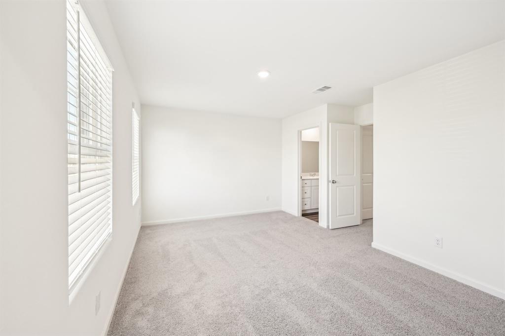2403 States Street Princeton, TX 75407 - Photo 8 of 39 Unfurnished bedroom featuring light colored carpet, ensuite bath, and recessed lighting