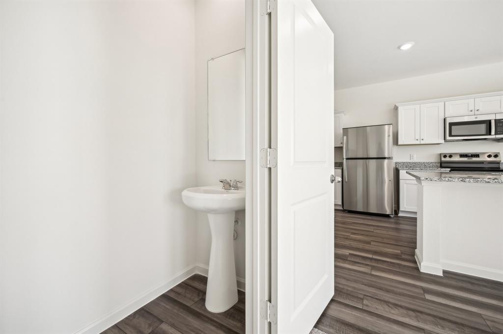 2403 States Street Princeton, TX 75407 - Photo 9 of 39 Bathroom featuring dark wood-style flooring and recessed lighting