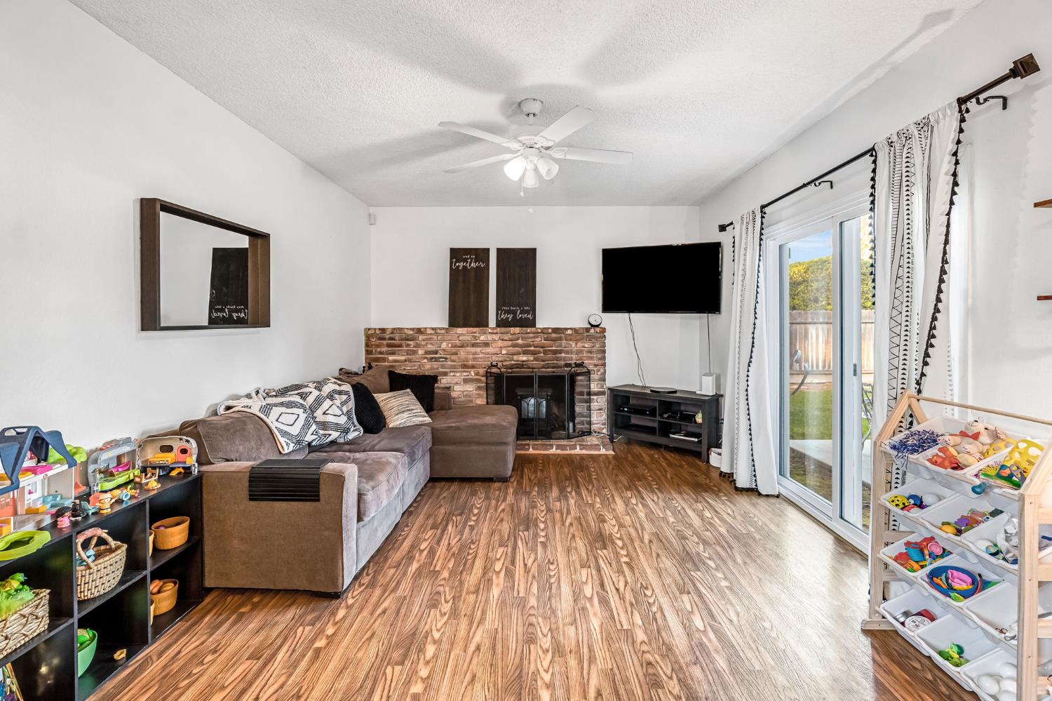 3120 West San Ramon Avenue Fresno, CA 93711 - Photo 14 of 36 a living room with furniture and a flat screen tv