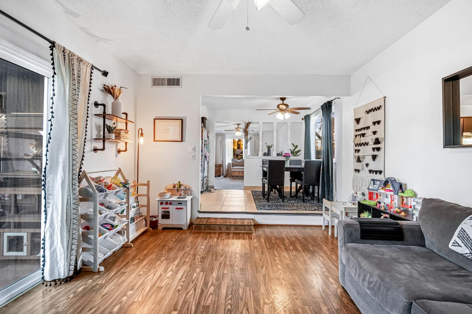 3120 West San Ramon Avenue Fresno, CA 93711 - Photo 17 of 36 a living room with furniture and wooden floor