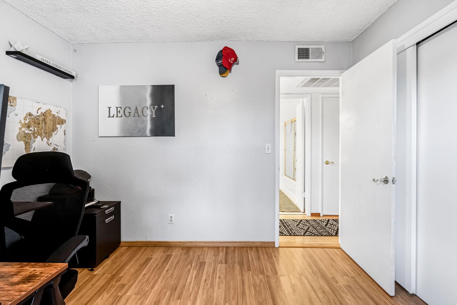3120 West San Ramon Avenue Fresno, CA 93711 - Photo 19 of 36 a view of a room with wooden floor and closet