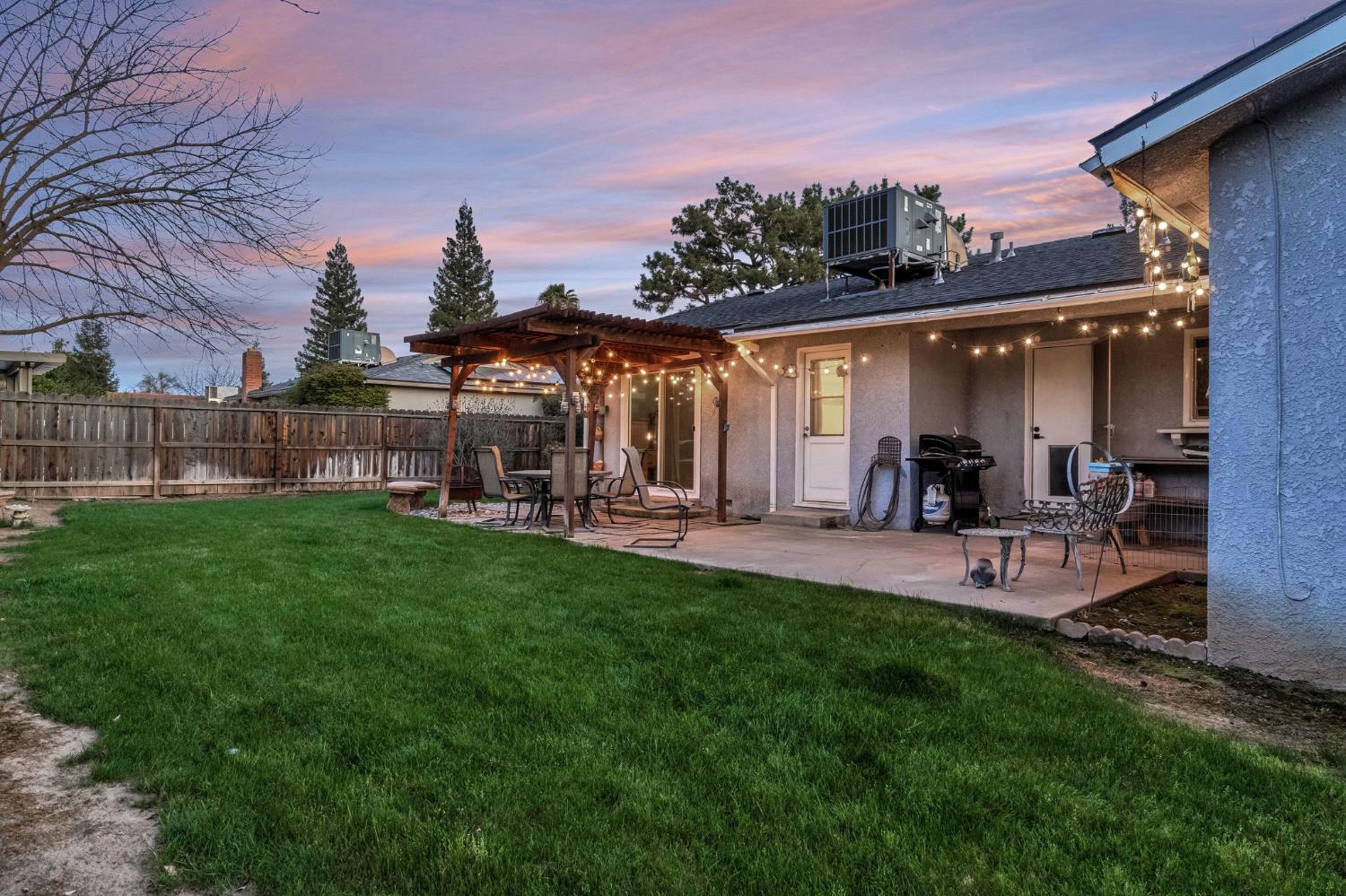 3120 West San Ramon Avenue Fresno, CA 93711 - Photo 28 of 36 a view of a house with backyard and sitting area