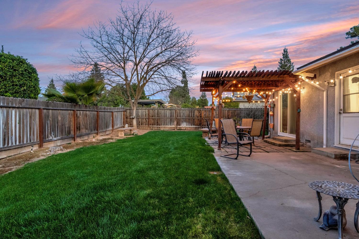 3120 West San Ramon Avenue Fresno, CA 93711 - Photo 30 of 36 a view of a house with a yard and sitting area