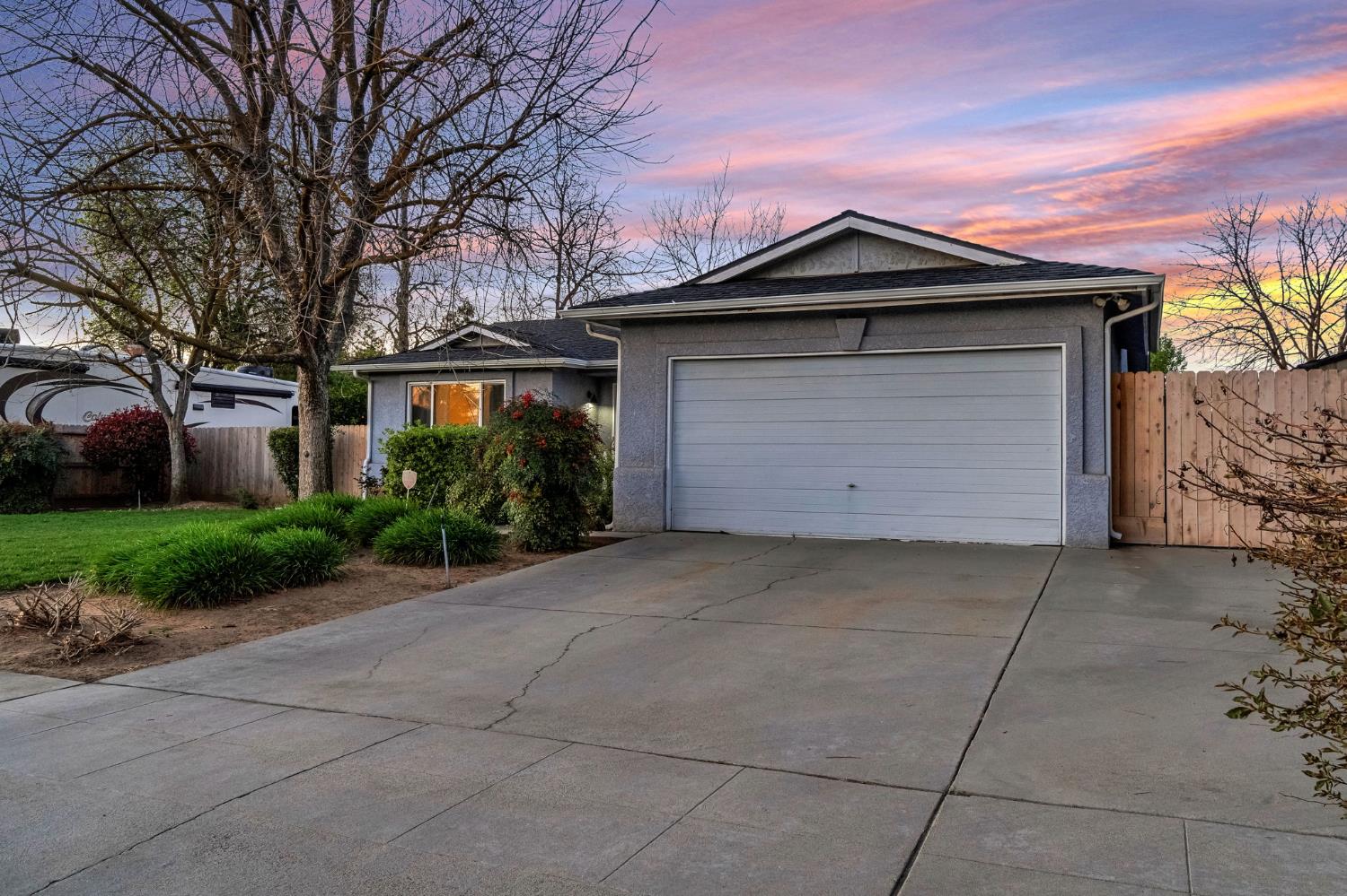 3120 West San Ramon Avenue Fresno, CA 93711 - Photo 3 of 36 a front view of a house with a yard and garage