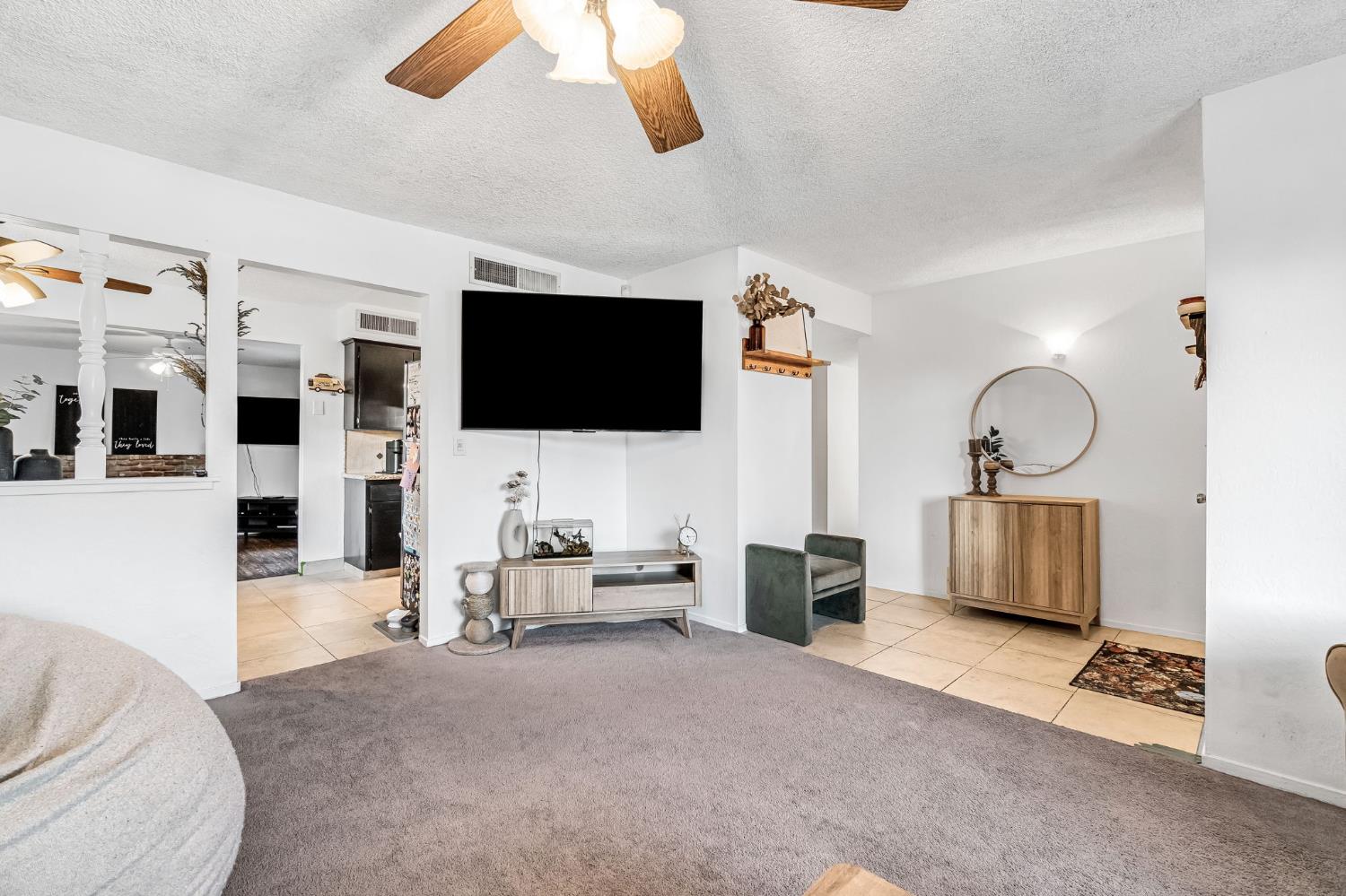 3120 West San Ramon Avenue Fresno, CA 93711 - Photo 7 of 36 a living room with furniture and a flat screen tv