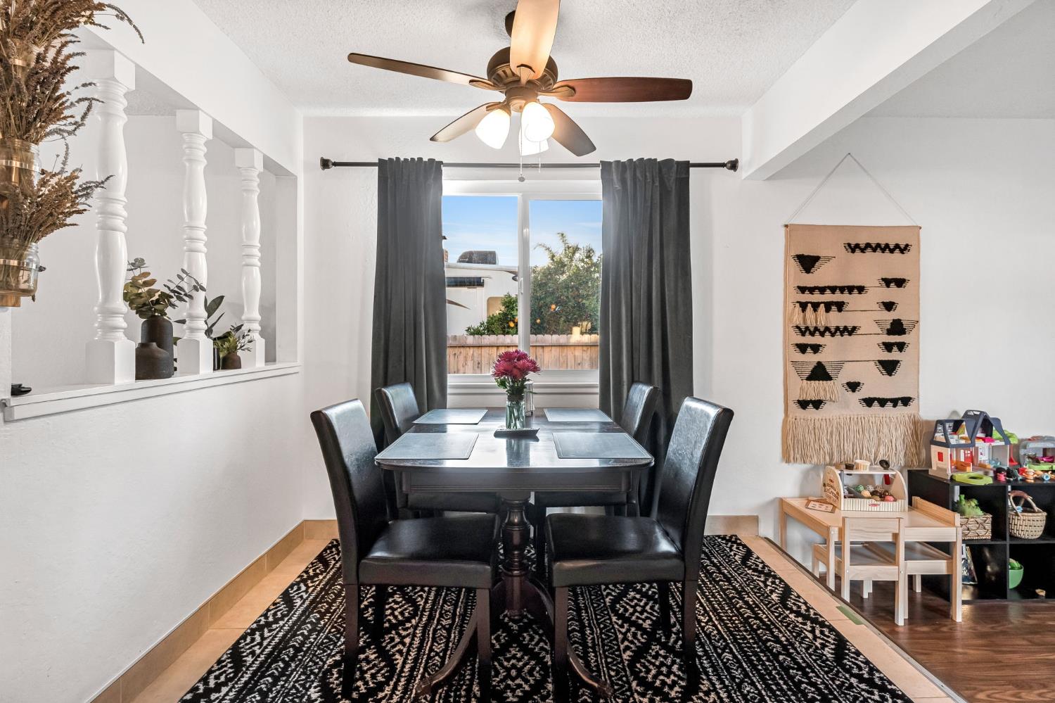 3120 West San Ramon Avenue Fresno, CA 93711 - Photo 8 of 36 a dining room with furniture a chandelier and wooden floor