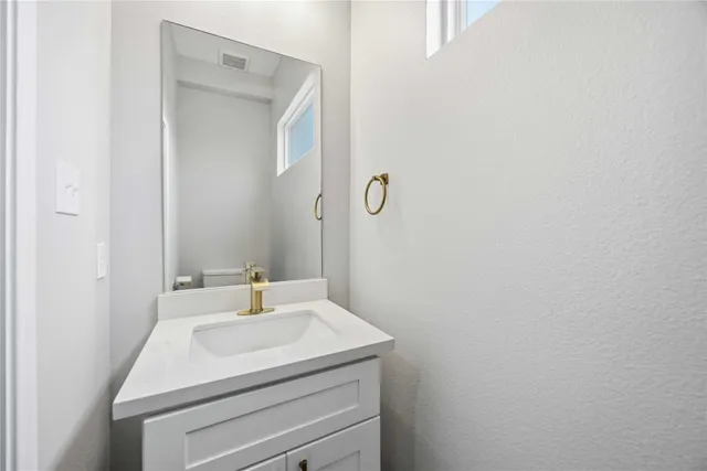 a view of room with window and ceiling fan