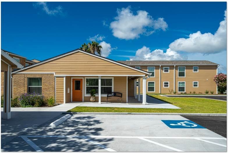 200 South Ave A, Unit 50 Aransas Pass, TX 78336 - Photo 2 of 14 a view of a house with a swimming pool and a yard