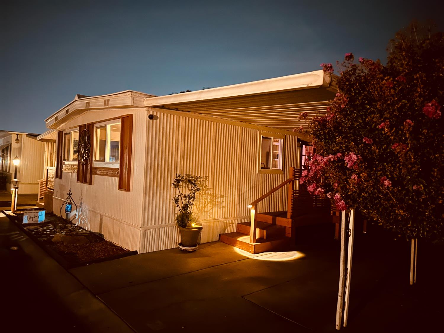 225 North Akers Road, Unit 308 Visalia, CA 93291 - Photo 55 of 72 a front view of a house with garden