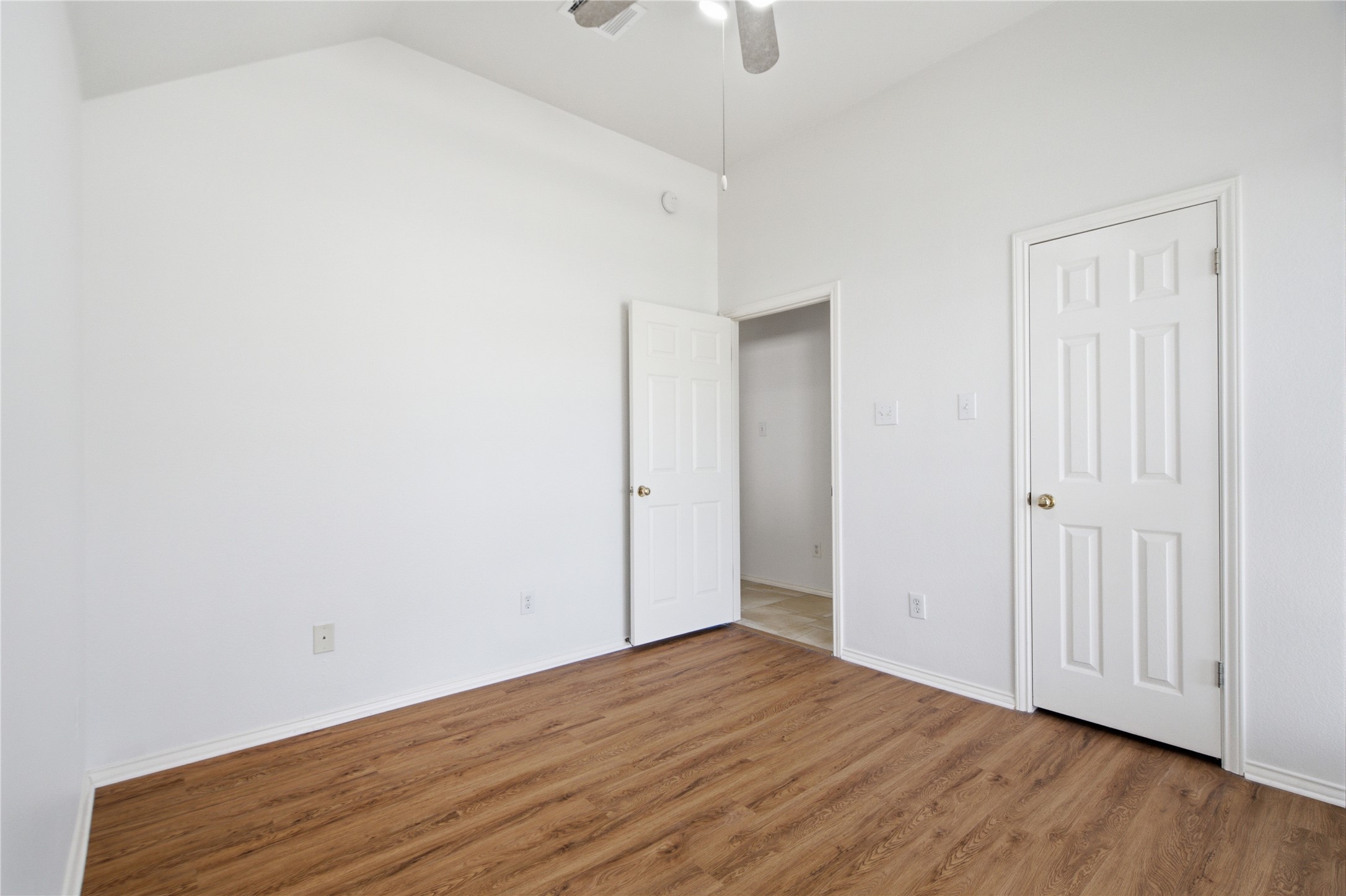 2920 Warwick Way Austin, TX 78748 - Photo 27 of 36 Secondary bedroom #3 features vaulted ceilings and rich wood-like flooring