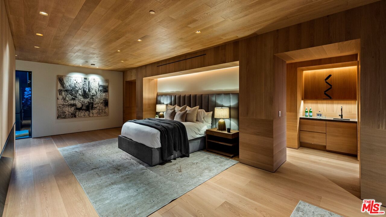 1663 Summitridge Drive Beverly Hills, CA 90210 - Photo 25 of 41 a bed room with furniture and a window