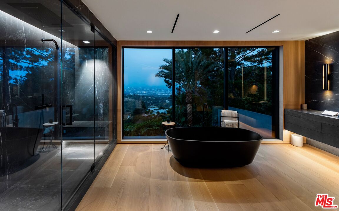 1663 Summitridge Drive Beverly Hills, CA 90210 - Photo 27 of 41 a lobby with a couch and an entryway