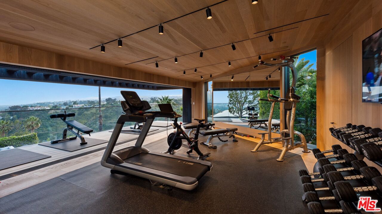 1663 Summitridge Drive Beverly Hills, CA 90210 - Photo 35 of 41 a view of a room with gym equipment