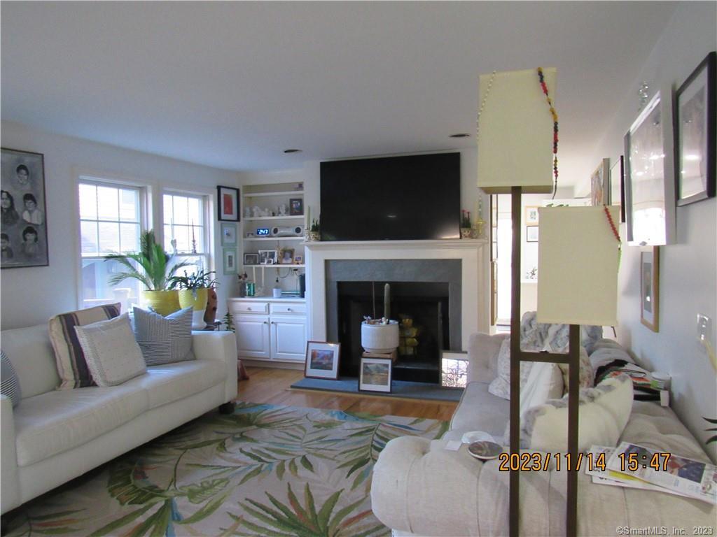 11 Blue Mountain Ridge, Unit 11 Norwalk, CT 06851 - Photo 1 of 1 a living room with furniture and a fireplace